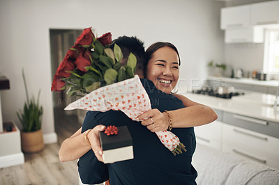 Buy stock photo Couple hug, home and roses present surprise of an Asian woman on valentines day. Living room, rose bouquet and lounge of people with love, care and happiness together with a smile from present