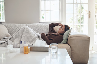 Buy stock photo Woman, sick and headache with medication on sofa for flu, cold or sinus in living room at home. Tired female person with illness, fever or influenza in fatigue or asleep on couch from paracetamol 