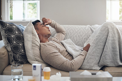 Buy stock photo Sick man, headache and medication with flu, sinus or pain from illness on living room sofa at home. Tired male person with migraine from high fever, influenza or infection on lounge couch at house