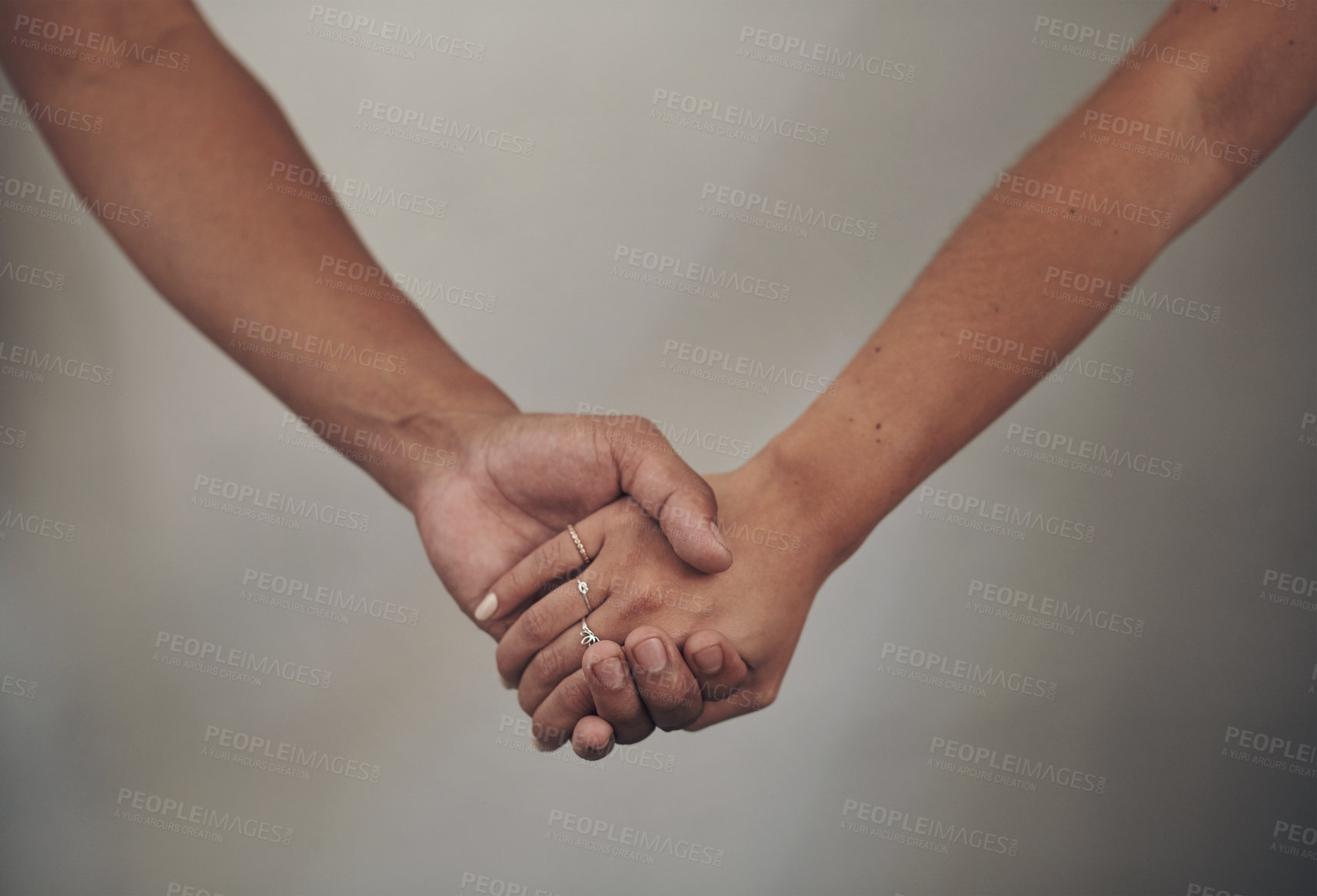 Buy stock photo Couple, love and holding hands for support, care and solidarity or romance with studio background. Compassion, partnership or relationship for people, marriage or hope or trust for affection together