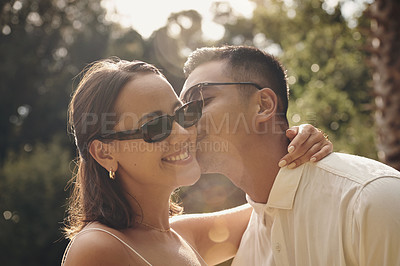 Buy stock photo Couple, kiss and love in park at sunset with support, care and trust in marriage, holiday or vacation with peace. Man, woman and calm moment outdoor together with loyalty, commitment or Mexico summer