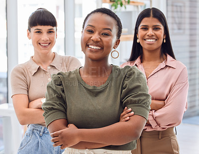 Buy stock photo Shot of three businesswomen standing together in an office