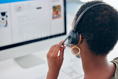 Buy stock photo Shot of a businesswoman wearing a headset while working on her computer