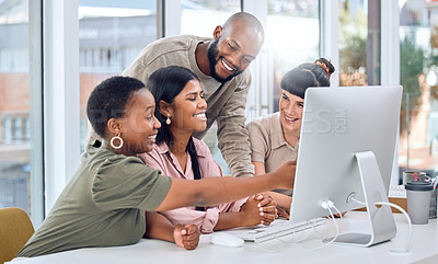 Buy stock photo Shot of a group of businesspeople discussing something on a desktop