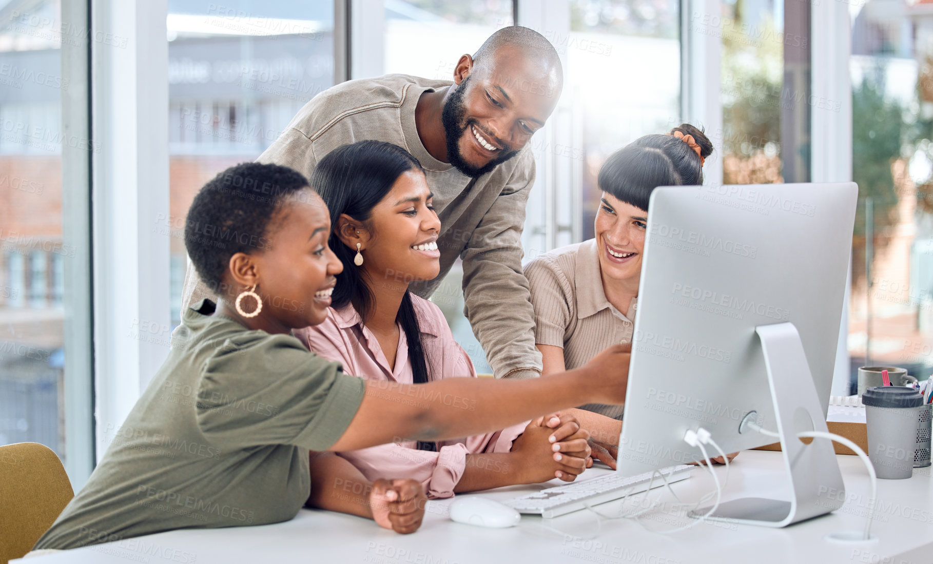 Buy stock photo Shot of a group of businesspeople discussing something on a desktop