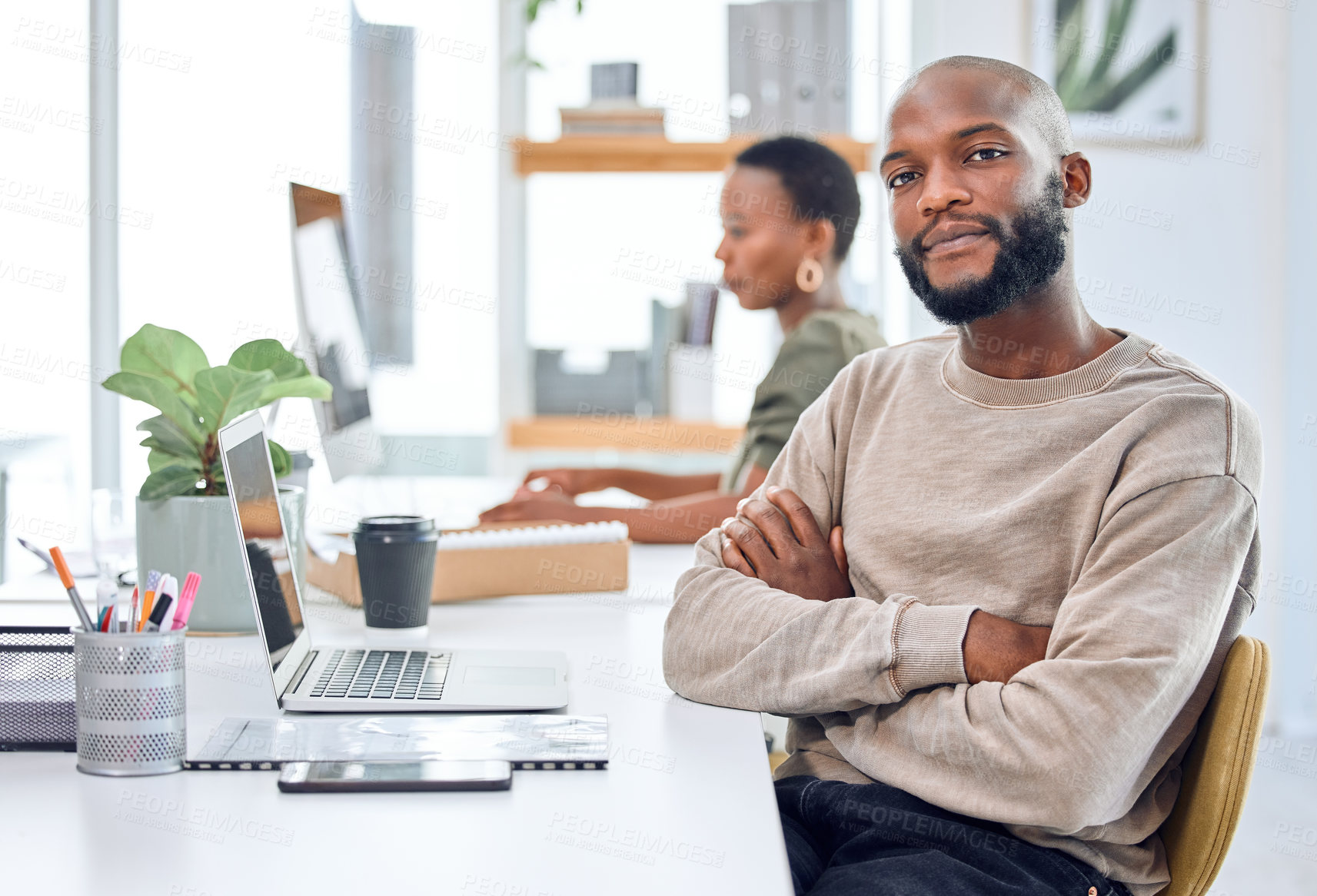 Buy stock photo Portrait of a confident businessman sitting at his desk