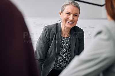 Buy stock photo Smile, office and mature woman at presentation with conversation, coaching and support at meeting. Workshop, employee engagement and happy business people with mentor for planning, leadership and fun