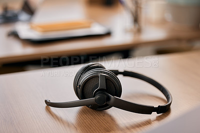 Buy stock photo Office, call center and headset on desk for customer support, online consulting and CRM business. Empty workplace, service and microphone on table for telemarketing, digital agency and contact