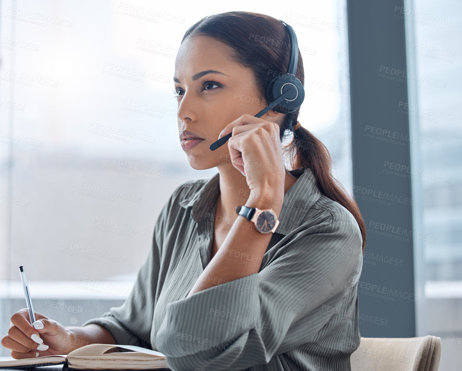 Buy stock photo Businesswoman, telemarketing and headset for contact at call centre for customer service, help and advice. Female person or crm in office with notepad for client support from virtual assistant