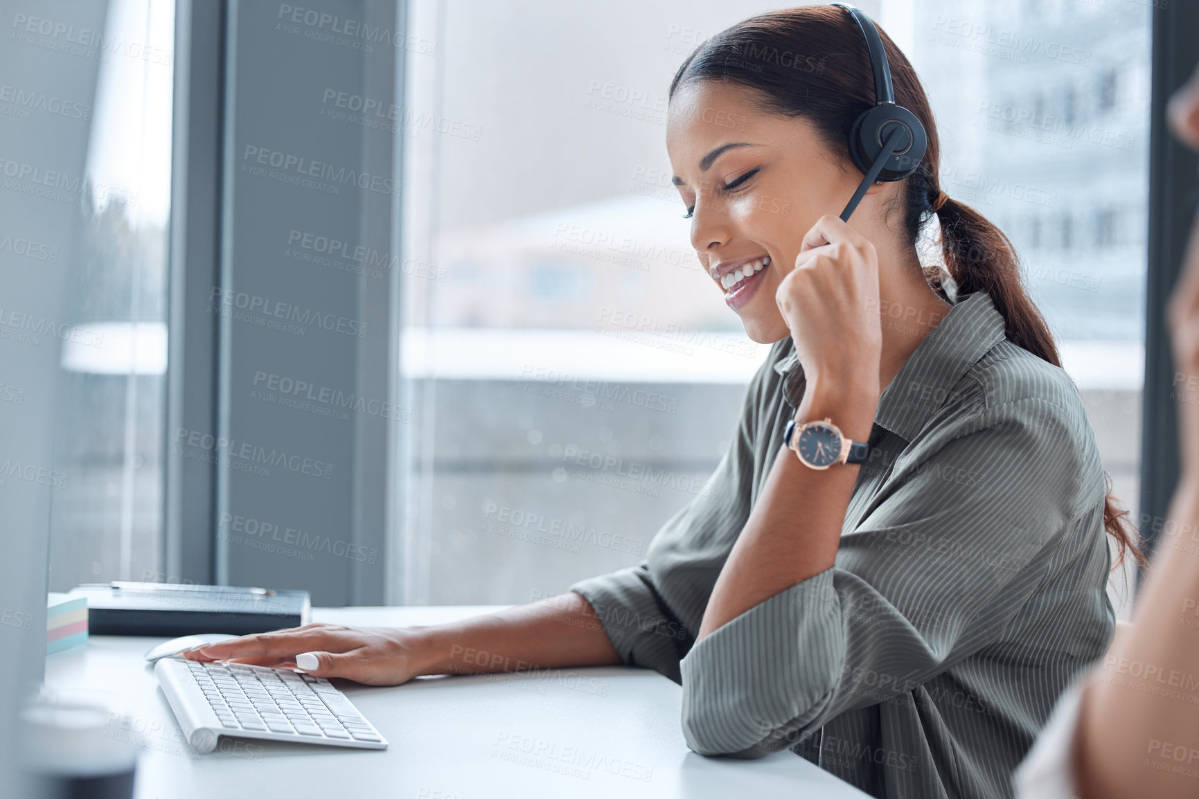 Buy stock photo Shot of a young businesswoman working in a call center