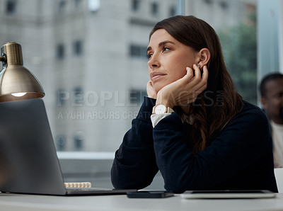 Buy stock photo Shot of a young businesswoman looking bored at work