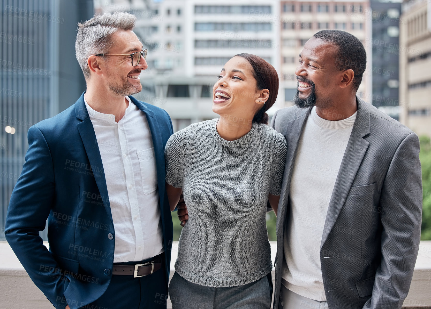 Buy stock photo Collaboration, hug and smile with business people on balcony of office in city for support together. Funny, happy or laughing with man and woman corporate employee team at workplace for comedy