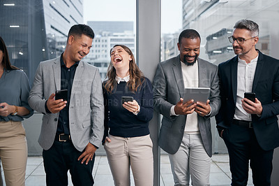 Buy stock photo Shot of a group of businesspeople using digital devices in a waiting room