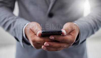 Buy stock photo Shot of a businessperson using a smartphone