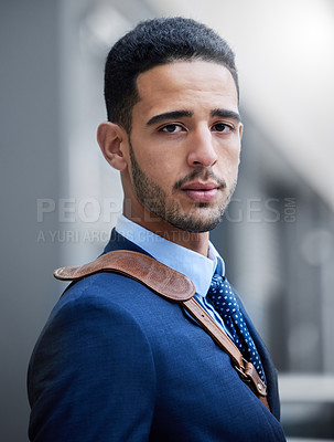 Buy stock photo Cropped portrait of a handsome young businessman on his morning commute into work