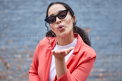 Buy stock photo Fashion, blowing kiss and portrait of woman on wall background in trendy, stylish and cool clothes. Beauty, flirt and happy female person pose in city with sunglasses, confidence and style outdoors