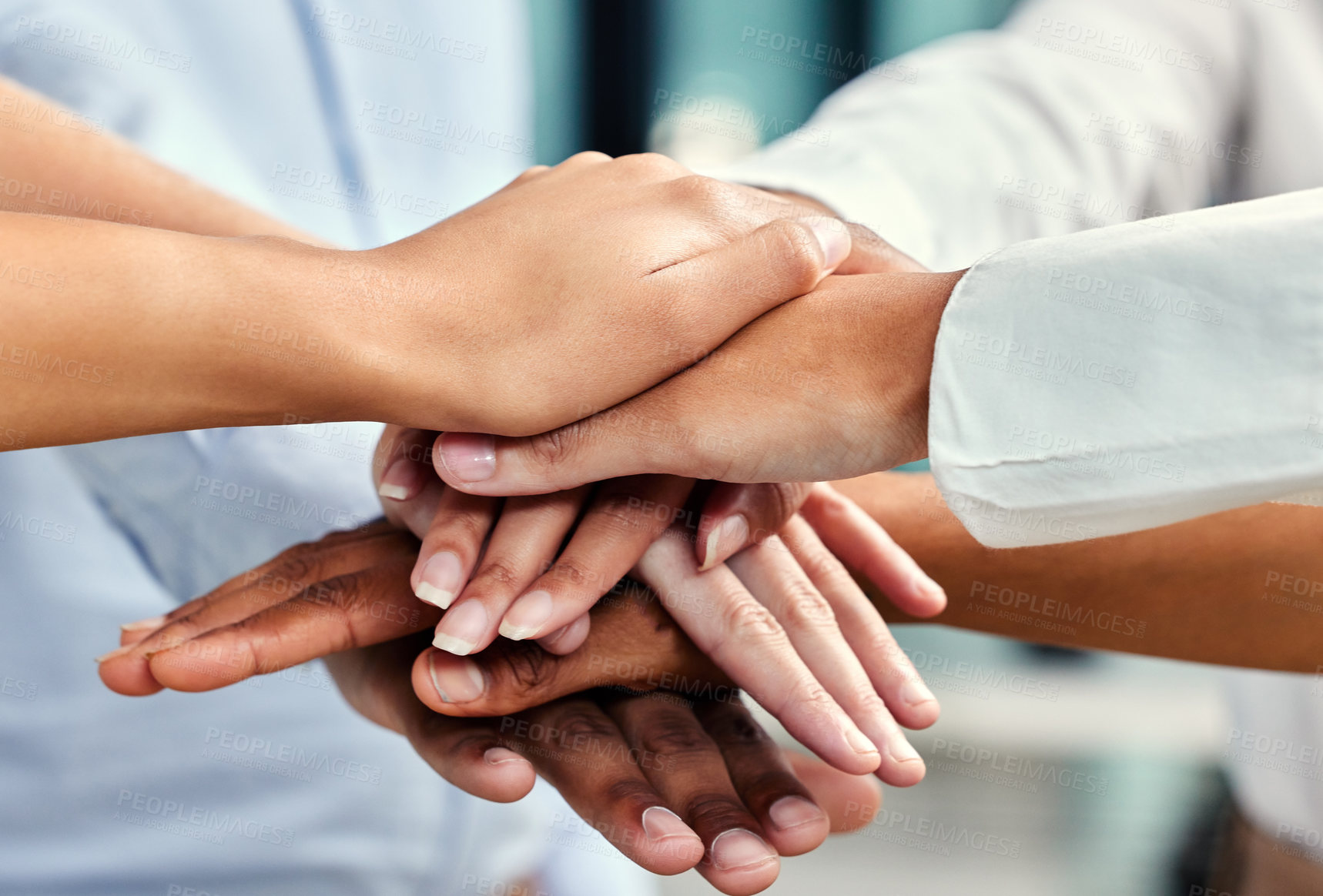 Buy stock photo Cropped shot of a group of unrecognizable businesspeople's hands stacked while in a huddle in their office
