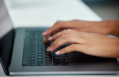 Buy stock photo Cropped shot of an unrecognizable businesswoman using her laptop while sitting in the office