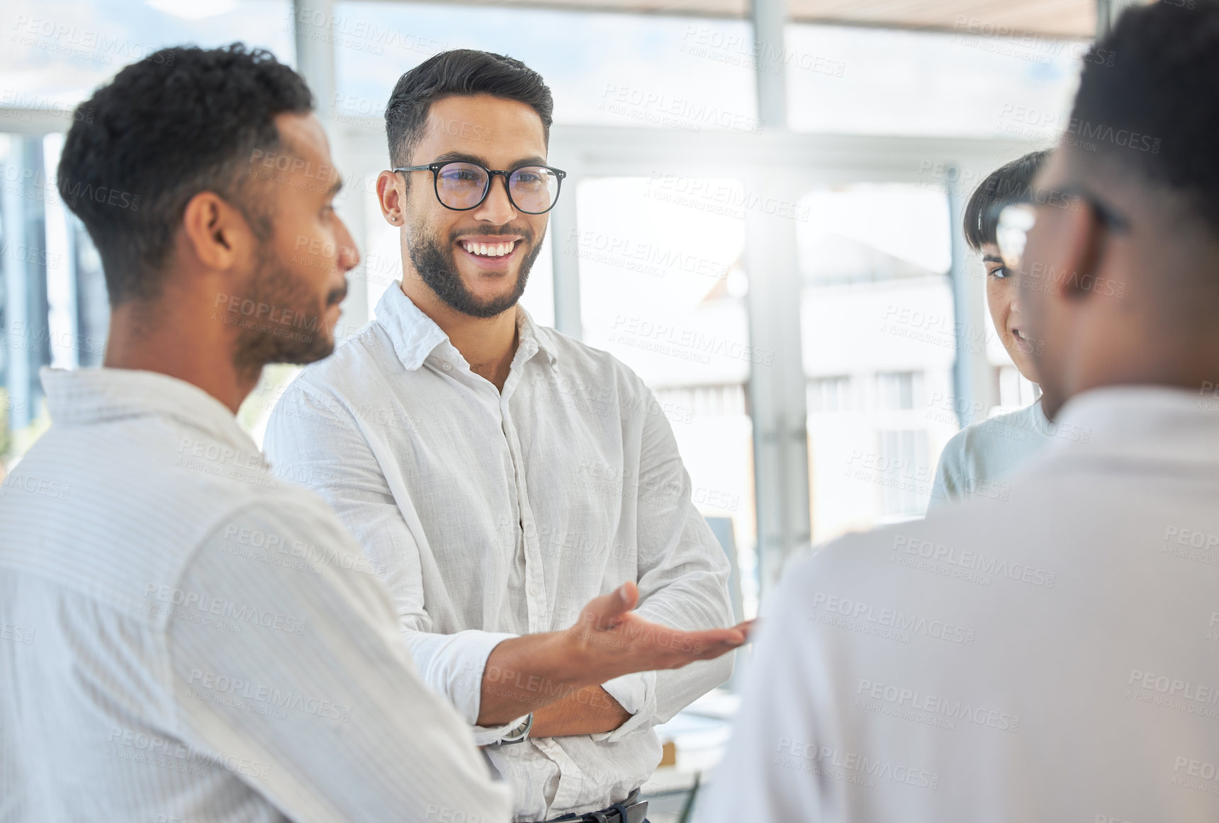 Buy stock photo Cropped shot of a group of young diverse businesspeople having a meeting in the boardroom