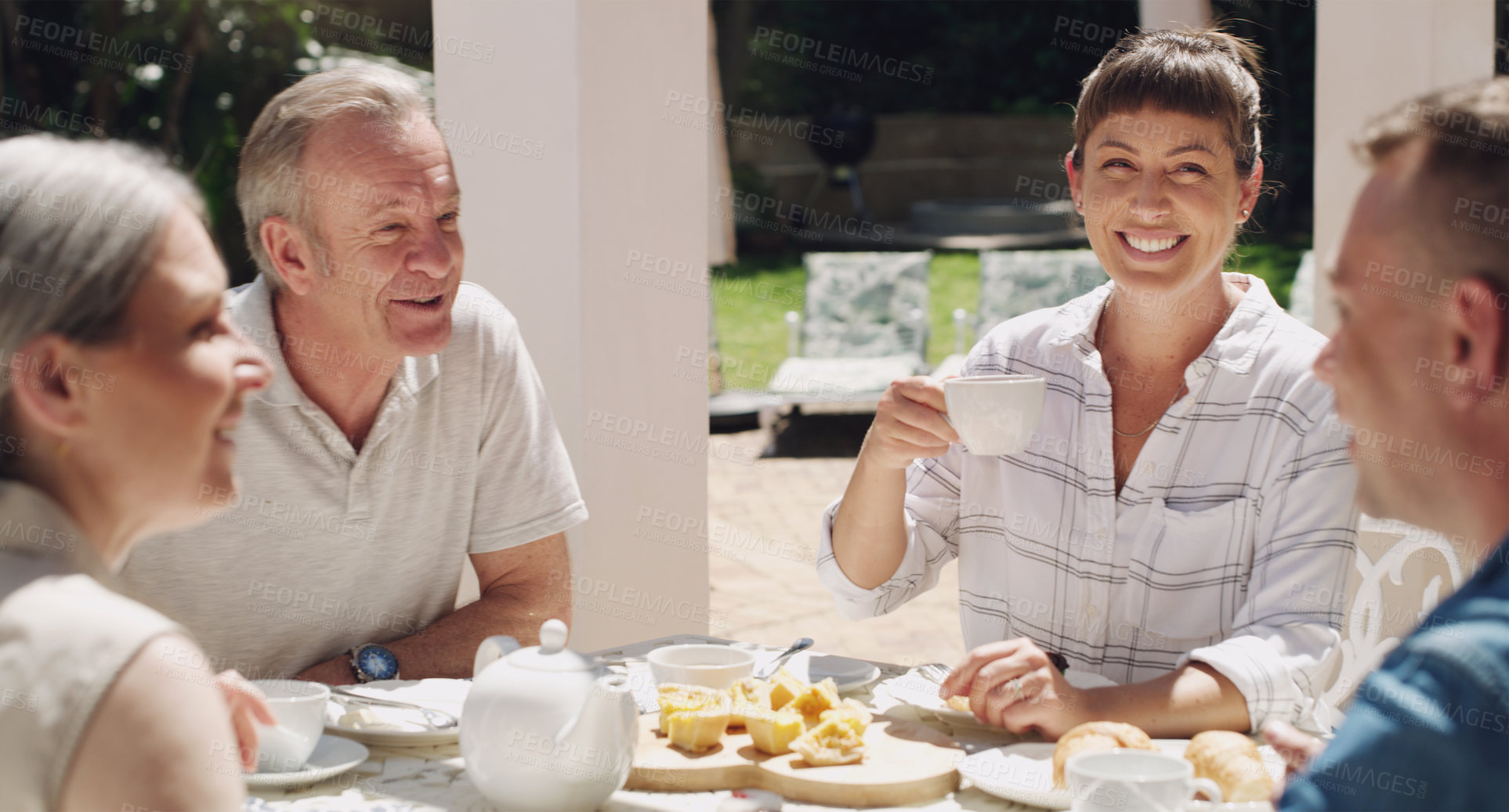 Buy stock photo Family, breakfast or eating outdoor meal with smile for love, bonding and conversation on weekend break. Happy, people and food with coffee drink in garden for relax talk or morning together