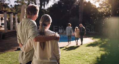 Buy stock photo Shot of a family enjoying the sunset in their backyard