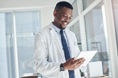 Buy stock photo Smile, medical and black man with tablet, office and telehealth in clinic, serious and online for healthcare. Workplace, hospital and internet for technology, doctor and science for research of staff