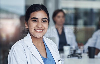 Buy stock photo Portrait, smile and female doctor at work, healthcare and medical professional. Happy, hospital and Indian surgeon or wellness, clinic and medicare in scrubs, career and life insurance or physician