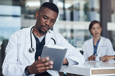 Buy stock photo Office, black man or doctor with tablet reading report, research or checking hospital schedule. Clinic, meeting and medical professional on digital app for telehealth, networking or consulting online