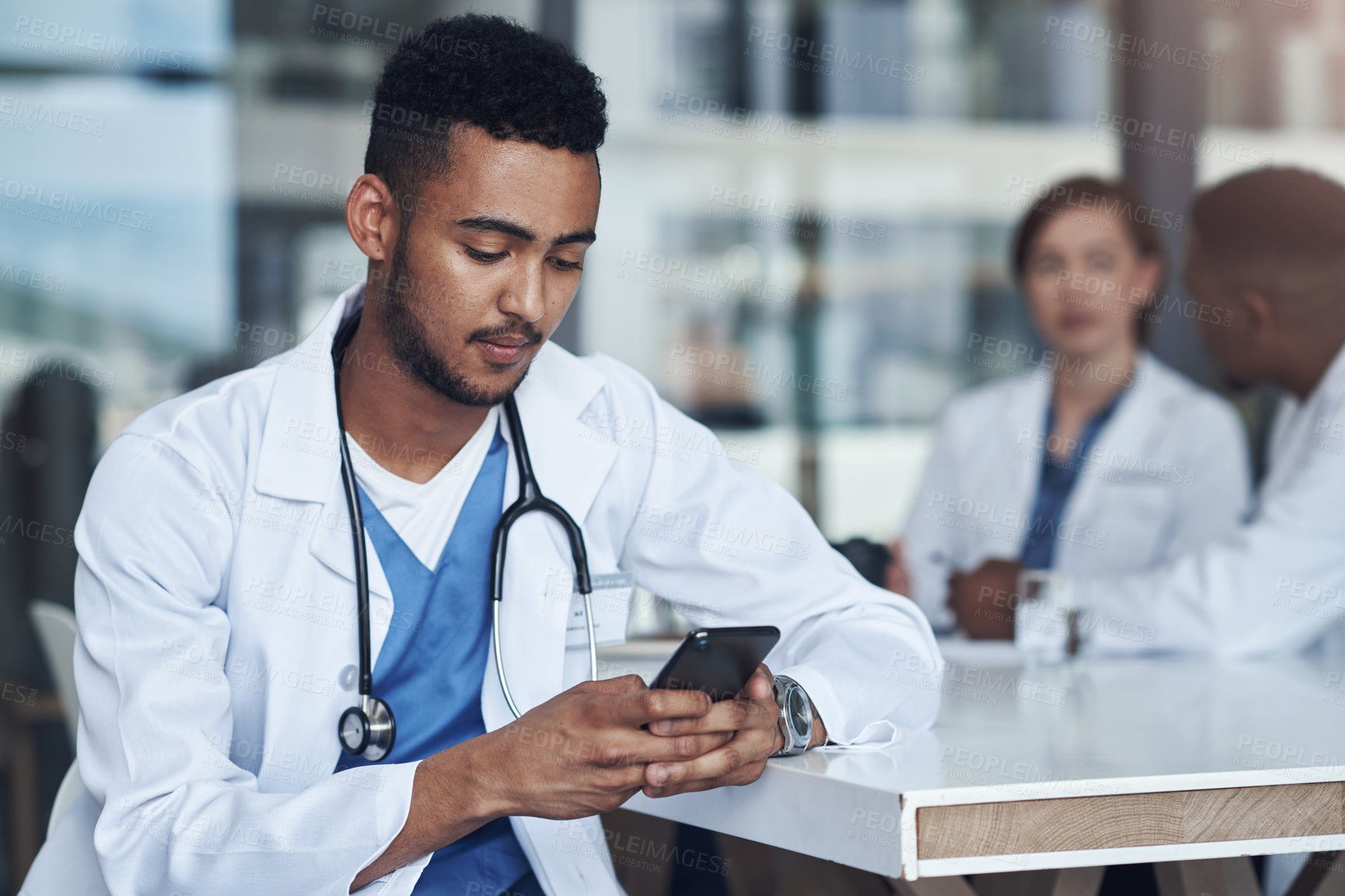 Buy stock photo Cellphone, male doctor and hospital for healthcare, physician and telehealth health staff. Texting, communication and virtual conversation for mobile medical consultation, stethoscope and smartphone