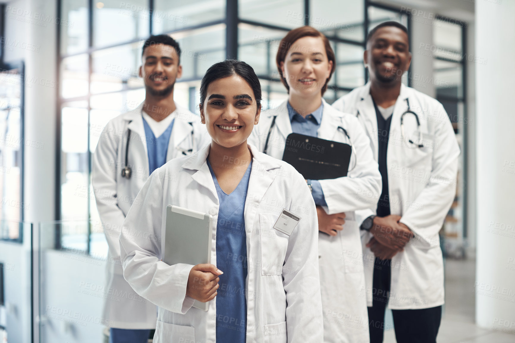 Buy stock photo Doctors, smile and portrait in hospital standing with clipboard for health care, wellness and solidarity. Clinic, surgeons or physicians together for medical advice, teamwork or collaboration