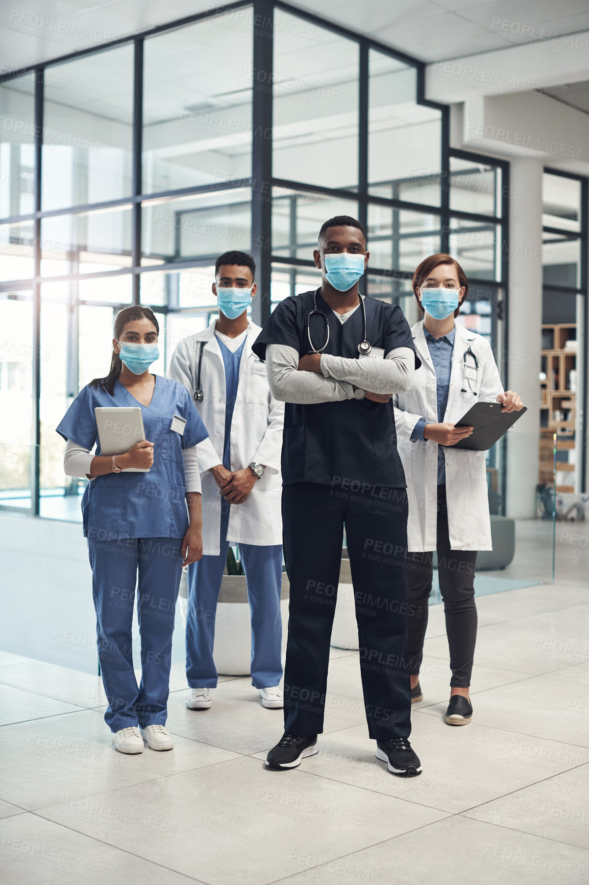 Buy stock photo Doctors, man and arms crossed with mask, group and portrait with diversity for medical career in hospital. Surgeon team, people and women with collaboration, wellness and ppe for healthcare services