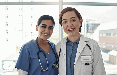 Buy stock photo Portrait, women and doctors in hospital, teamwork and confidence with pride, medical and cooperation. Face, people and medical with professional, hug and mentor with intern, collaboration and embrace