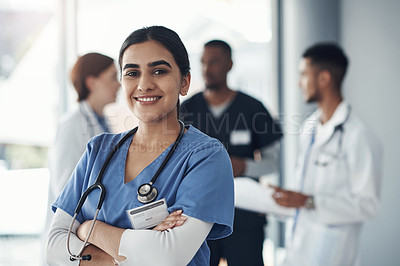 Buy stock photo Portrait, nurse and happy woman with arms crossed in hospital for healthcare career, wellness or proud doctor. Face, smile and confident medical professional surgeon, expert or coworking employee