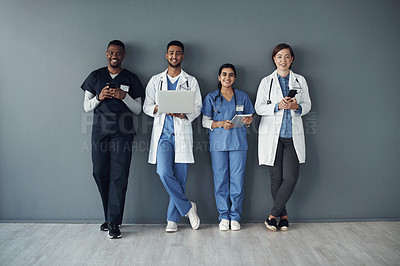 Buy stock photo Row, doctors and happy team by wall for interview or public health conference and training session. Technology, medical staff and line for patient rounds or daily briefing, online review and proud.