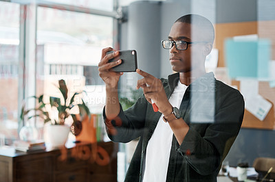 Buy stock photo Black man, phone and reading notes in office schedule, agenda and email for startup business. African, male person and scroll with website for review, feedback and notification of project proposal