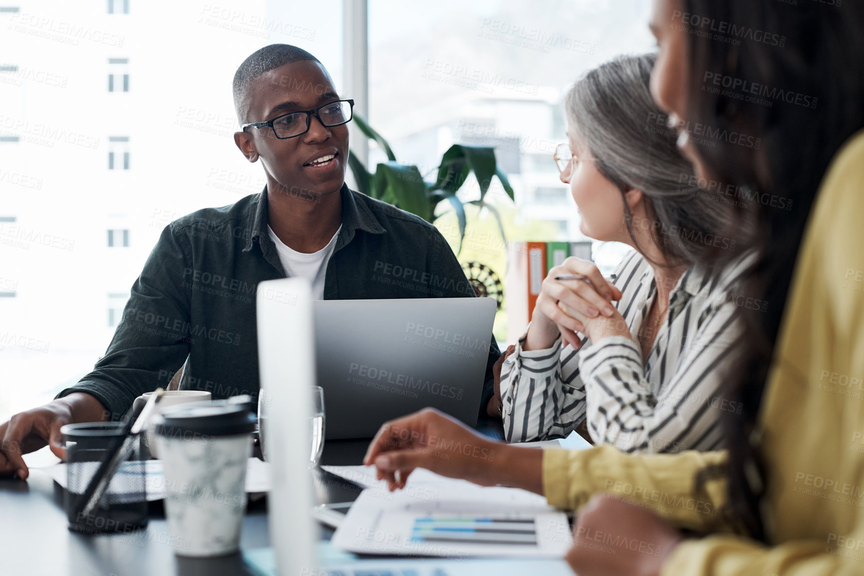 Buy stock photo Business people, meeting and teamwork or listening to ideas of online project, collaboration and planning on laptop. Creative group in office discussion with public relations statistics or graphs