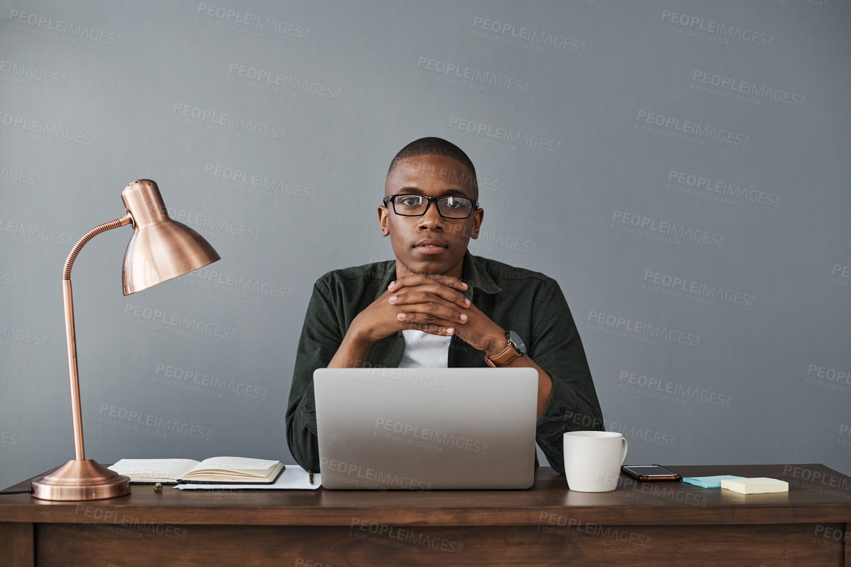 Buy stock photo Confident black man, laptop and portrait in office for software, online research and working in creative startup business. Face, computer and web developer in glasses or African entrepreneur in Kenya