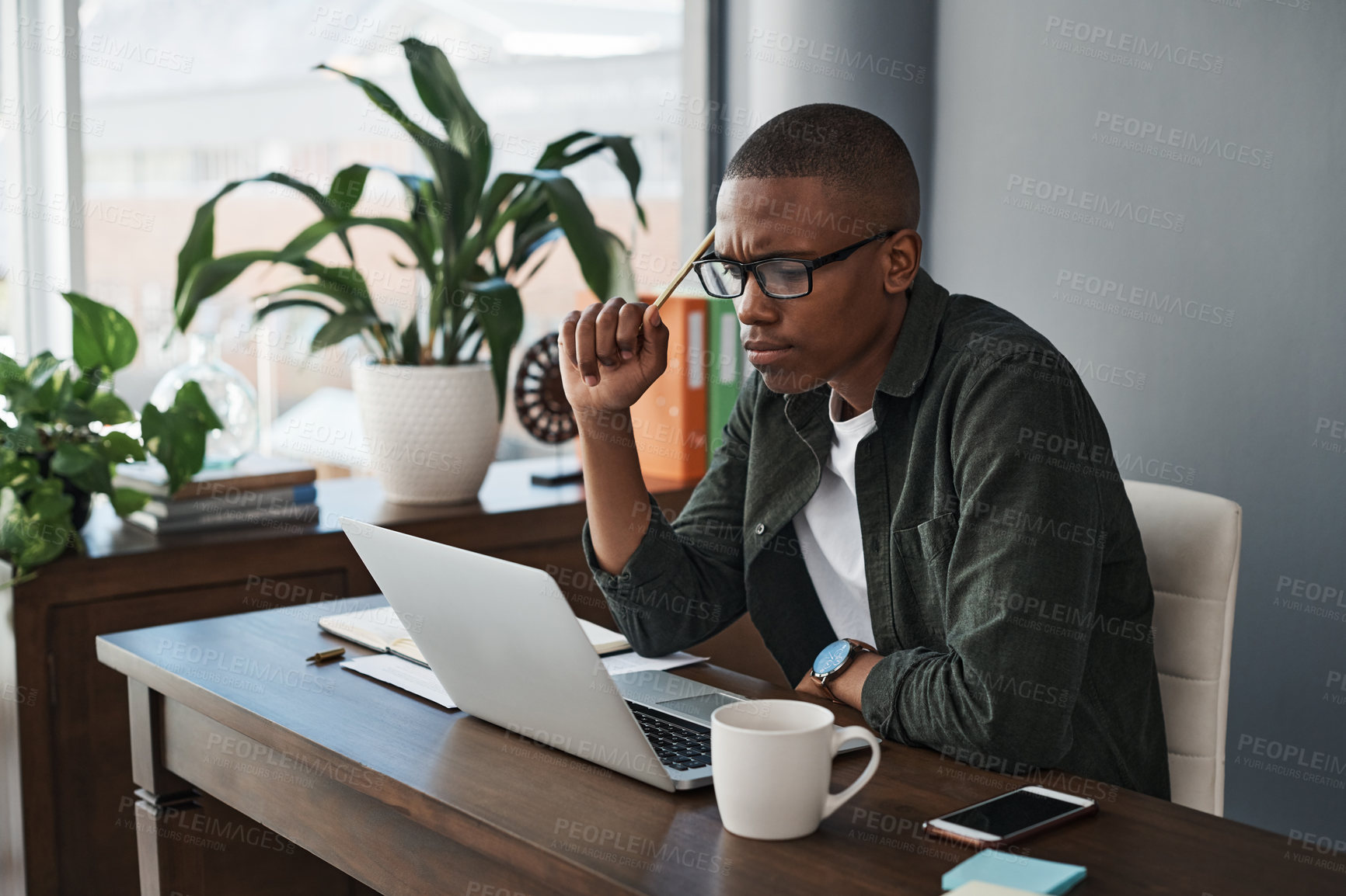 Buy stock photo Laptop, idea and black man with doubt, confused or problem solving for software in creative startup. Computer, web designer and reading email for thinking, brainstorming or planning business decision