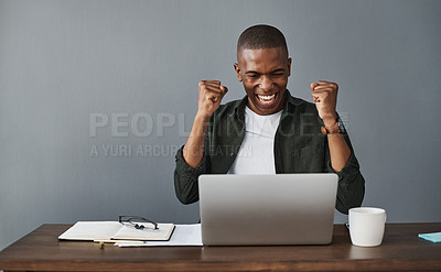 Buy stock photo Shot of a young businessman celebrating while working from home