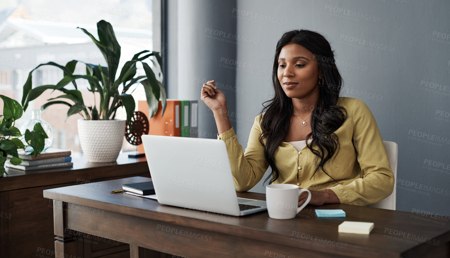 Buy stock photo Shot of a young businesswoman working from home