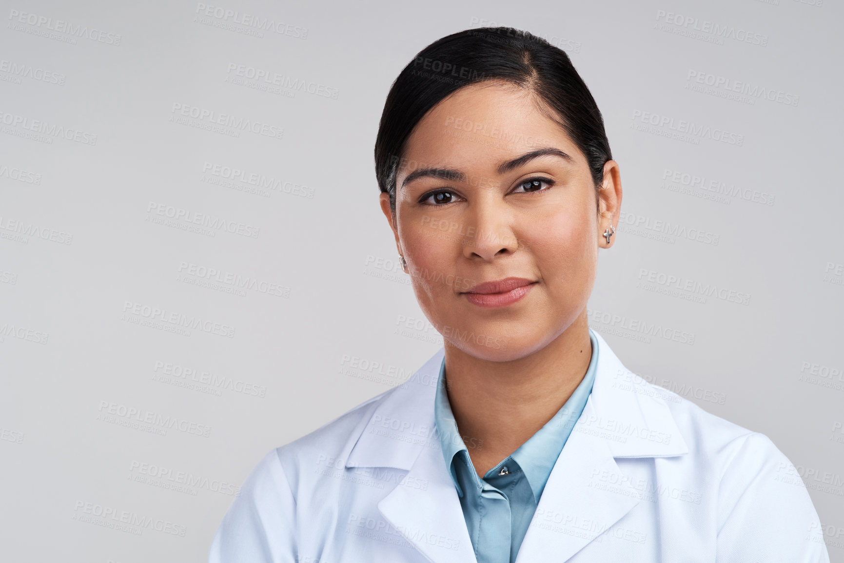 Buy stock photo Cropped portrait of an attractive young female scientist posing in studio against a grey background