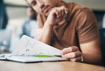 Buy stock photo Shot of a young businessman working in an office