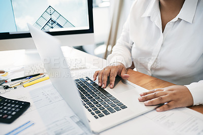 Buy stock photo Shot of an unrecognizable businessperson using a laptop in an office