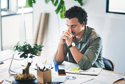 Buy stock photo Shot of a young businessman in pain in an office