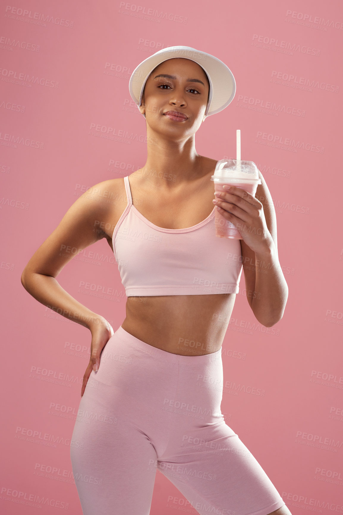 Buy stock photo Fitness, protein shake and woman with portrait in studio, post workout drink and supplement for hydration. Confident, training and athlete with smoothie for wellness, nutrition and pink background