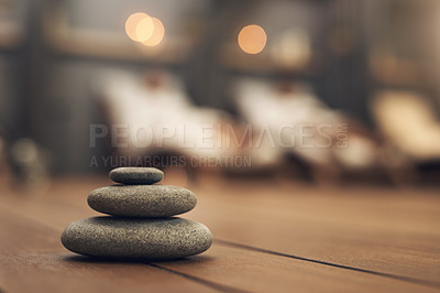 Buy stock photo Shot of three stones balanced on top of each other in a spa