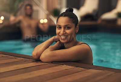 Buy stock photo Shot of a young woman relaxing in a pool at a spa