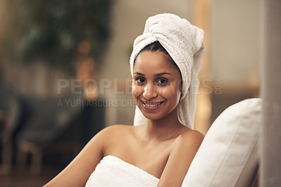 Buy stock photo Shot of a woman wearing a towel around her head while enjoying a spa day