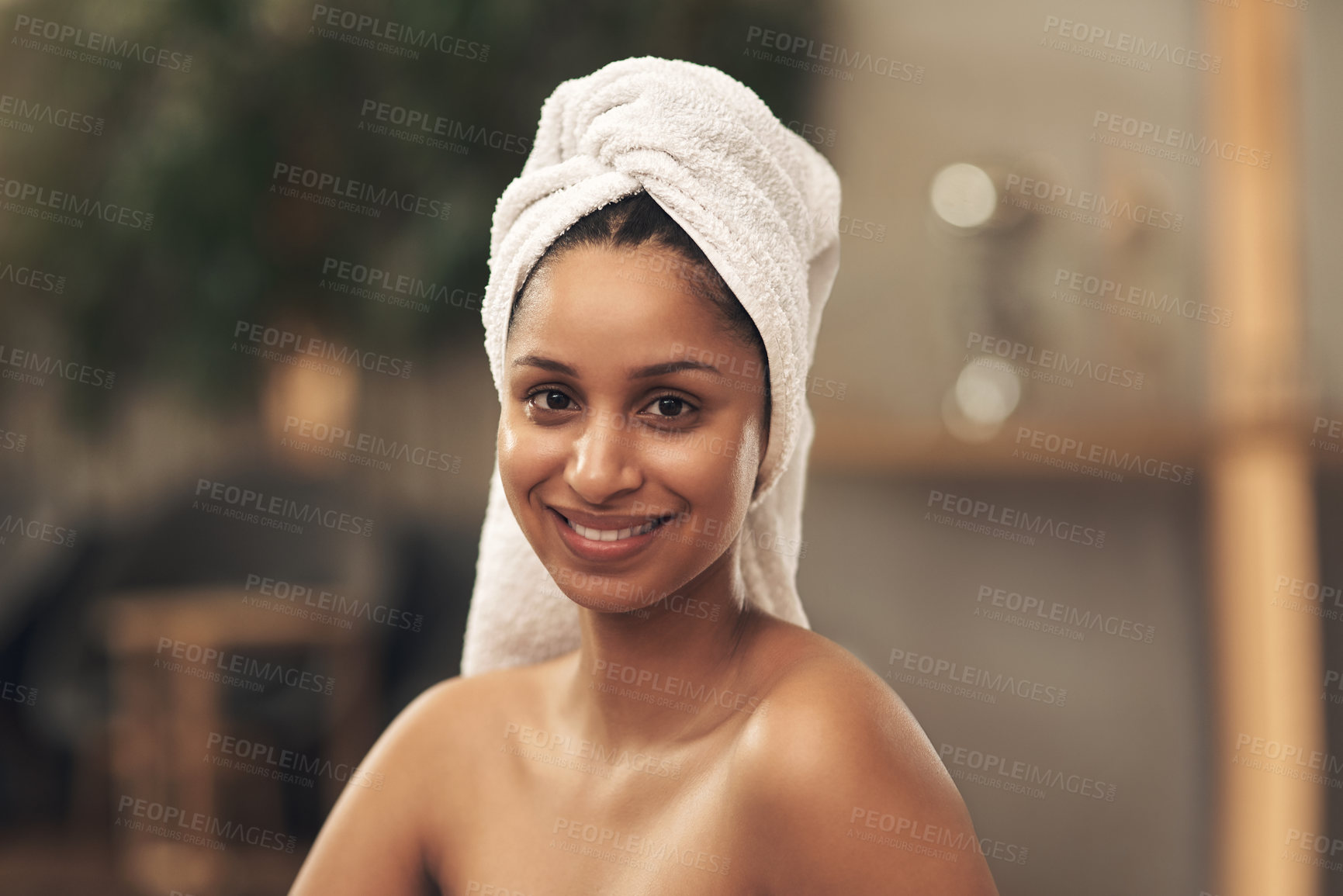 Buy stock photo Shot of a woman wearing a towel around her head while enjoying a spa day