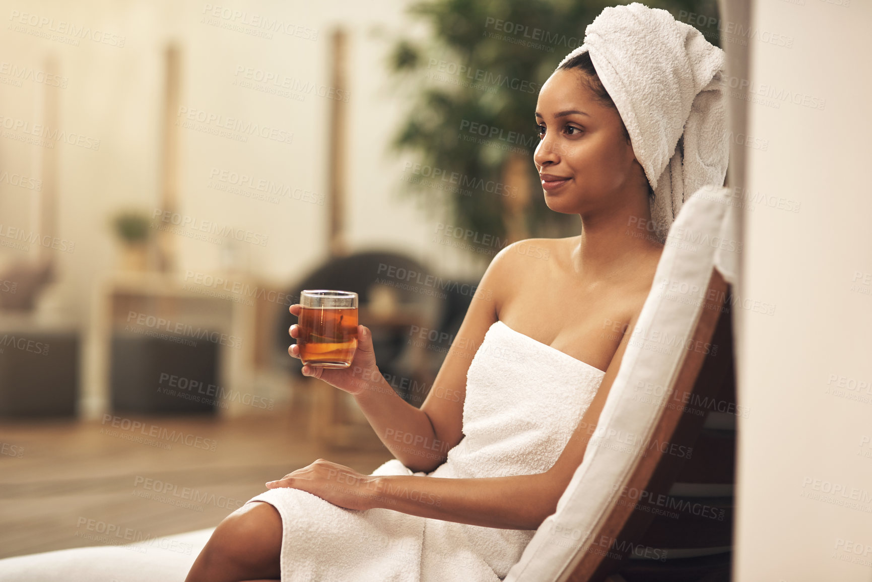 Buy stock photo Shot of a woman drinking tea while enjoying a spa day